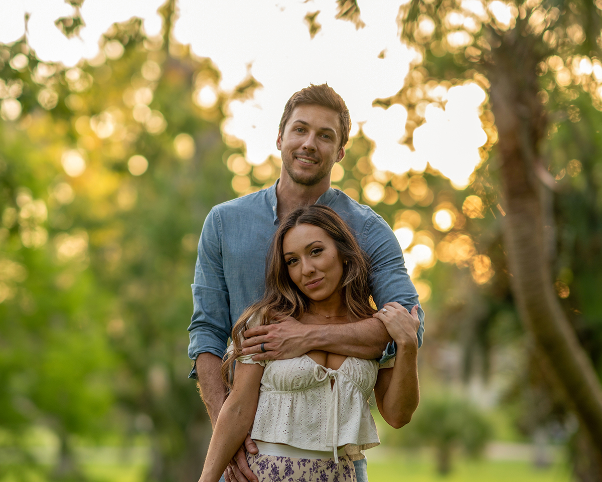 Ashley Aucoin and Laine Golay smiling together during a romantic St. Augustine sunset