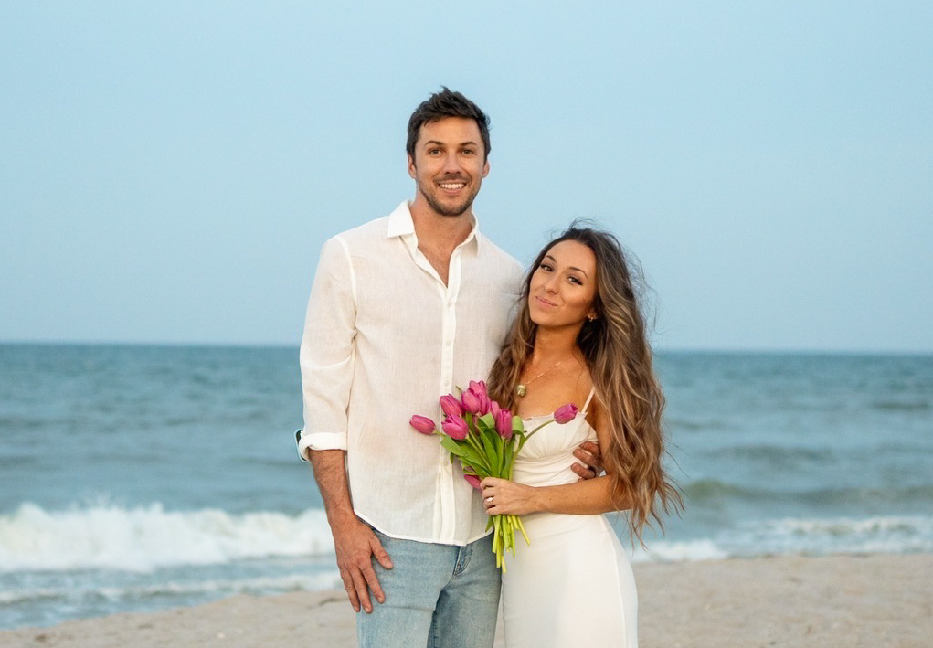 Candid photo of Ashley Aucoin and Laine Golay laughing together during their engagement photos