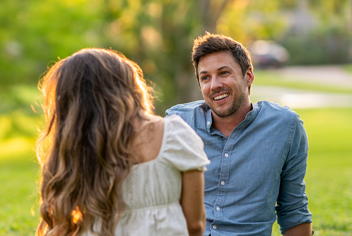 Ashley Aucoin and Laine Golay embracing in a cozy outdoor moment in St. Augustine