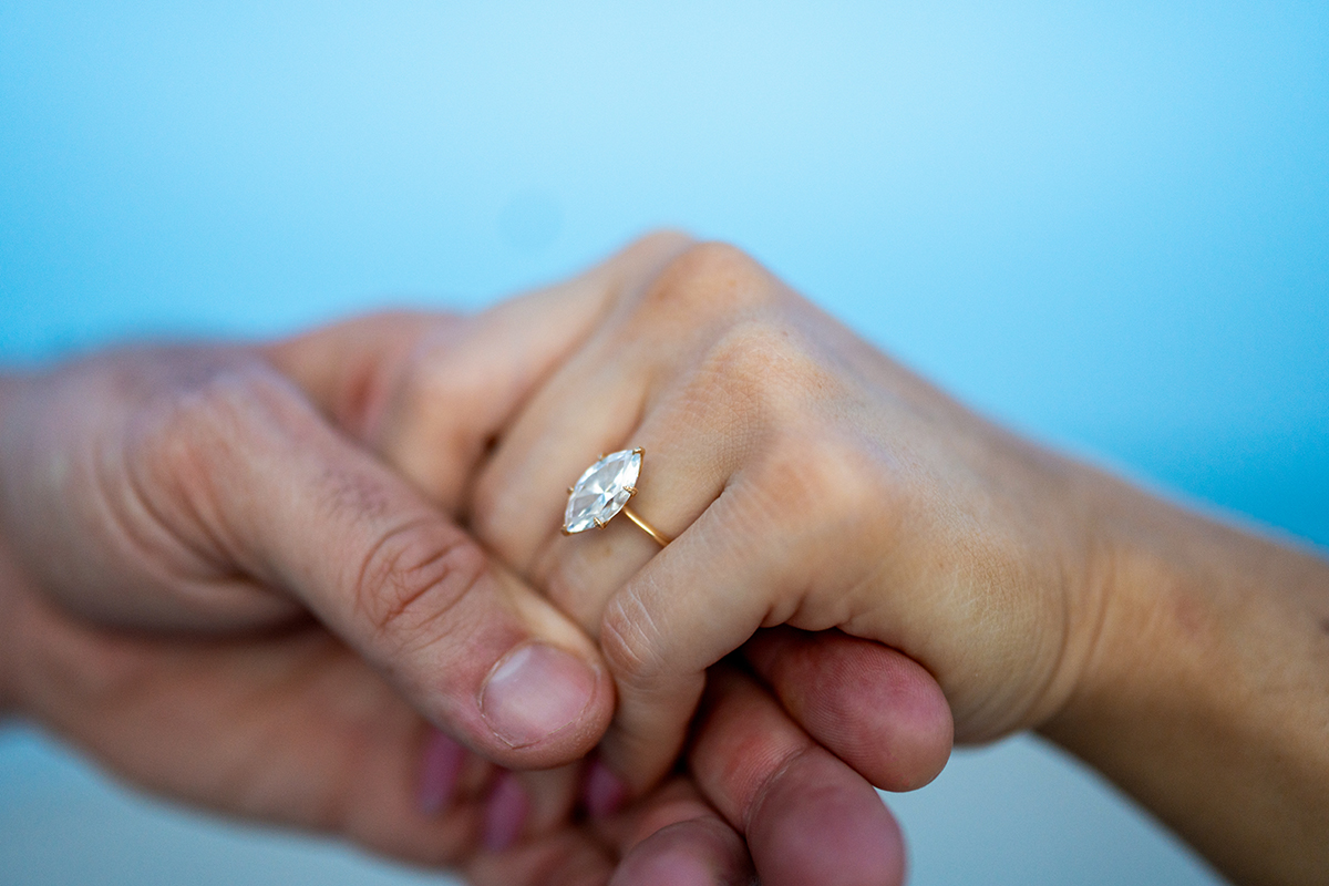 Ashley Aucoin and Laine Golay sharing a soft, candid moment by the water in St. Augustine